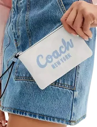 Coach Corner Zip Wristlet In Signature Canvas With Coach Script